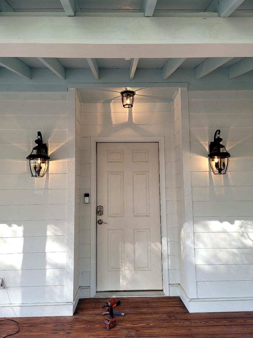Home exterior with outdoor lighting installed by Safety 1st Electrical Services